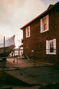 a boat parked in front of a house